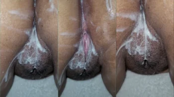 Uma mulher negra atraente com a buceta cheia de esperma