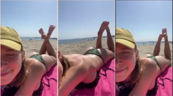 Desfrutando do sol na praia, sem sutiã e dando uma trocadinha na ousadia